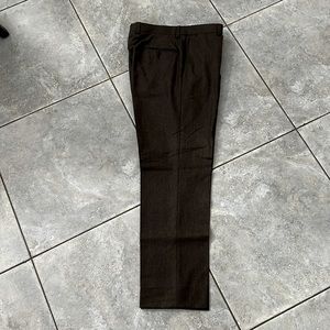 "Saks' brown dress pants: style, impeccable fit for sophisticated elegance."